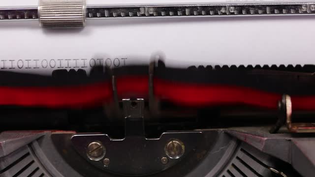 sequence of ones and zeros in binary code written with old typewriter