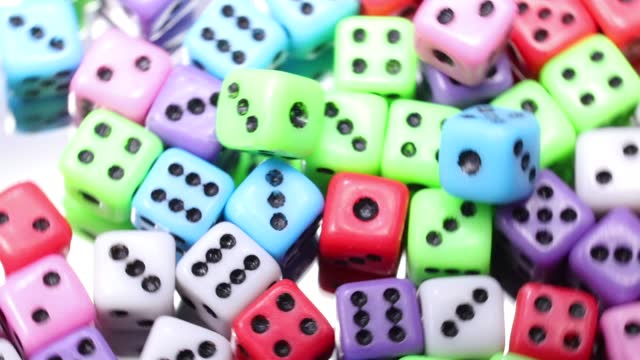 background of lots of gaming dice spinning on the rotating table