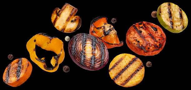 istock Grilled vegetable slices on black background 2148994755