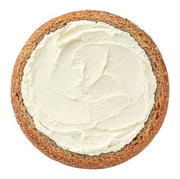 istock Round slice of rye bread with cream cheese, top view 2148994759