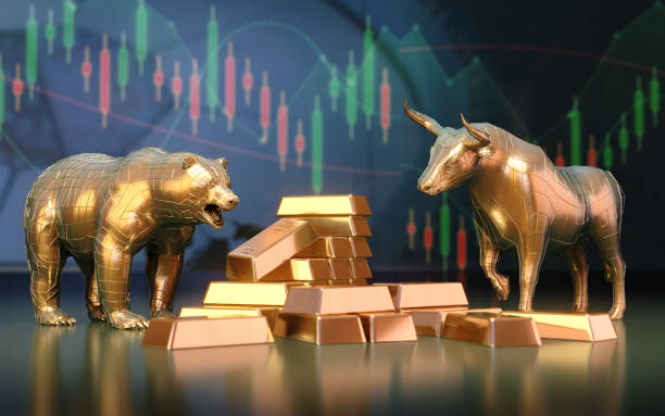 istock Gold Bars and Bull Bear Season Sitting on Financial Chart Background 2148994964