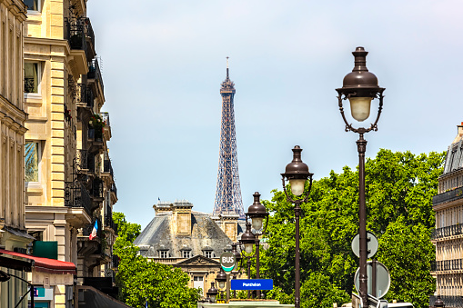 Old lantern in Paris with Eiffel Tower in the background