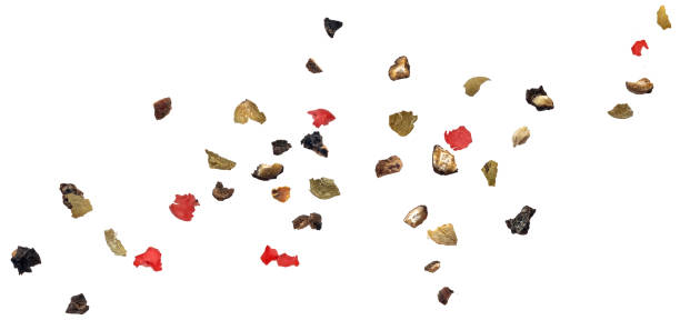 Ground peppercorn splash isolated on white background
