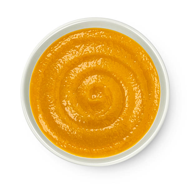 istock Pumpkin cream soup isolated on white background, top view 2148995874