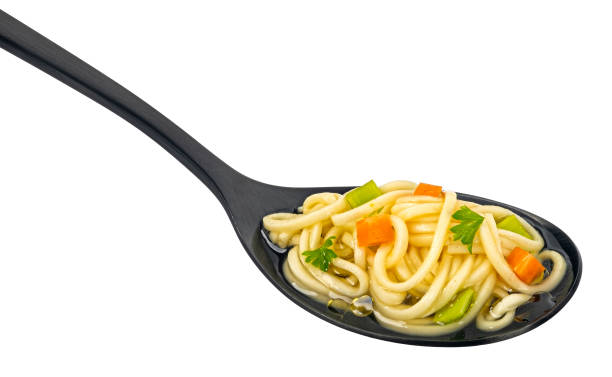 istock Instant noodle soup in black spoon isolated on white background 2148995902