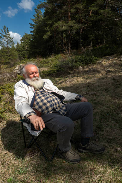 istock Retired Senior Men at Picnic. Resting under the sunlight 2148996127