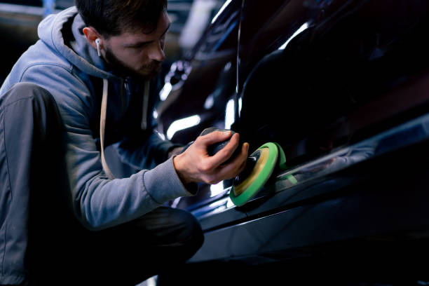 istock auto mechanic at service station doing final polishing until it shines 2148997738