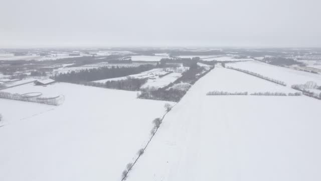 White Countryside Under the Snow At Wintertime during Daytime - Aerial Drone Shot