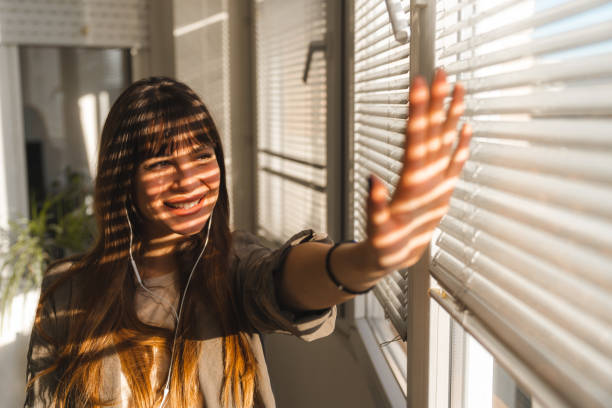 istock Shadows stripes on the woman's face 2148998681