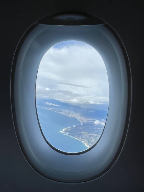 Taking off from Los Angeles - window plane view. California Southern coastline.