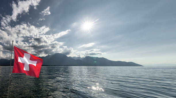 Lake Geneva with Swiss flag in backlight