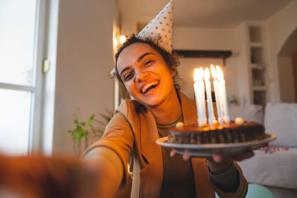 istock Adjusting laptop camera for online birthday party 2148999329