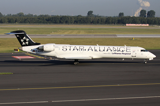 Dusseldorf, Germany - September 8, 2012: German Lufthansa Regional Bombardier CRJ700 with registration D-ACPS in Star Alliance livery on taxiway at Dusseldorf Airport