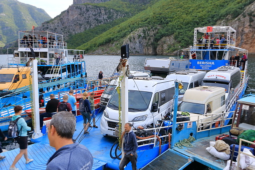September 20 2023 - Lake Koman in Albania: people and cars waiting at the Ferry pier for crossing the lake