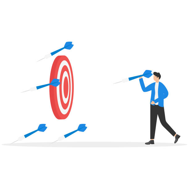 istock businessman throws many dart arrows hit out of the dartboard, missing the marketing target and customer, fail on company mission and goal 2149000663