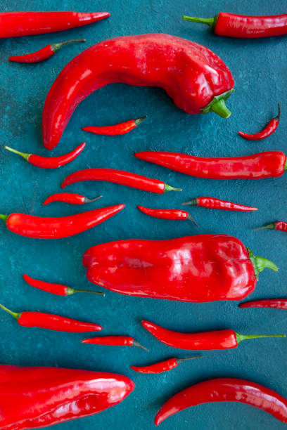 istock Fresh spicy chili peppers and paprika top view 2149000862