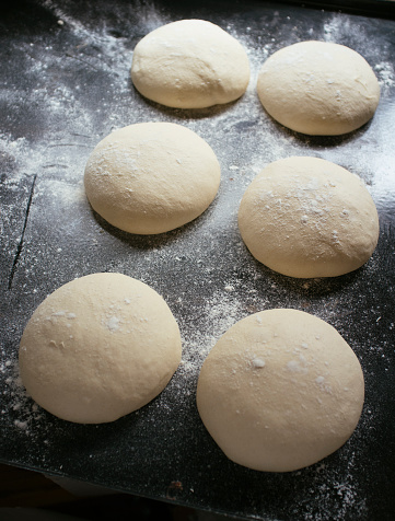 pizza dough rolls on baking tray