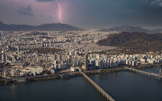 Lightning thunder over the capital city of Seoul in South Korea and the Han River.