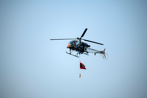 Kolkata, India 12th December 2023 : Indian air force helicopter is flying on isolated blue sky