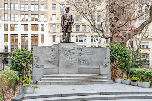Manhattan, New York, USA - March, 2024.  Madison Square Park sculpture in New York City.  This is of David Farragut, 'Admiral Farragut Monument', is an outdoor bronze statue of David Farragut by Augustus Saint-Gaudens on a stone plinth designed by the architect Stanford White, installed in Manhattan's Madison Square, in the U.S. state of New York in May 25, 1881.