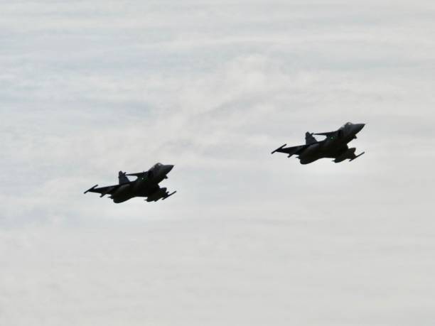 istock Two Jas 39 Gripen fighter jets flying low past the camera 2149002826