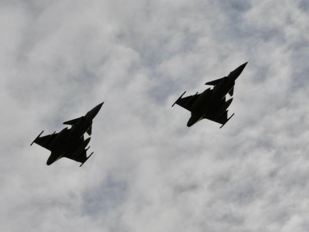 istock Two Jas 39 Gripen fighter jets flying low over the camera 2149002853