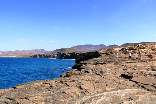 La Pared, Fuerteventura, Canary Islands in Spain - November 23 2023: People enjoy the coast landscape and beach
