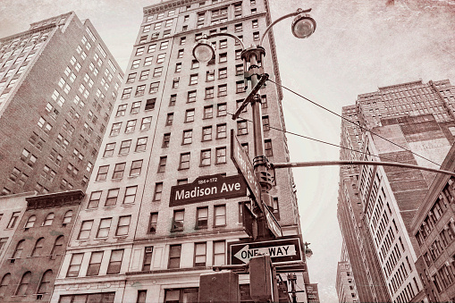 Road signs for Madison avenue and East 33rd Street in Manhattan.