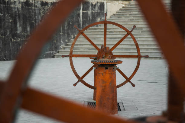 Rusty Valve in shape of wheel for opening a river dam