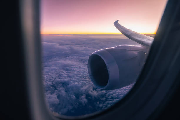 istock View from airplane window during flight above clouds at dusk 2149003566