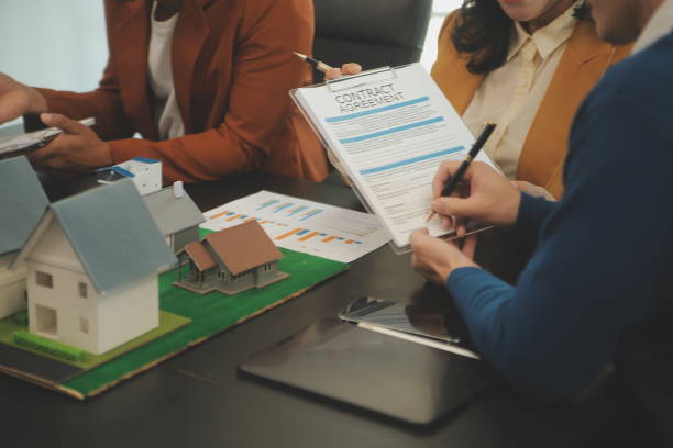 istock Team of architectures and businessmen discussing and brainstorming on floor plan modification for real estate investment and housing development project 2149004281