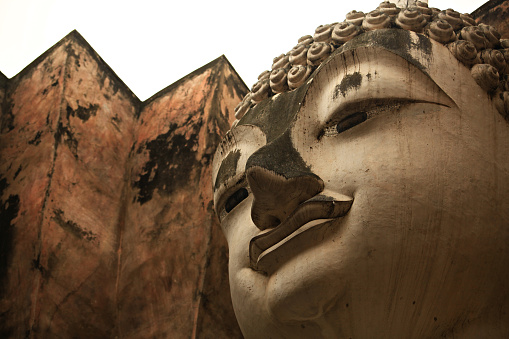 Wat Si Chum in Sukhothai Historical Park is a historic site big statue of Buddha Phra Achana Sukhothai in Asia Thailand