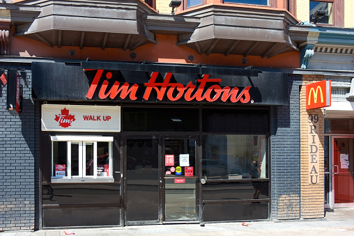 Ottawa, Canada - April 16, 2023: Tim Hortons on Rideau Street offer customers an option to order and pick up coffee and goods through a walk up window.  Tim Hortons is a very popular coffee and doughnut shop in Canada, it has actually reached iconic status. It was co-founded by NHL all-star Tim Horton in 1964.