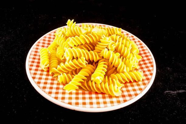 A plate of pasta with a checkered pattern