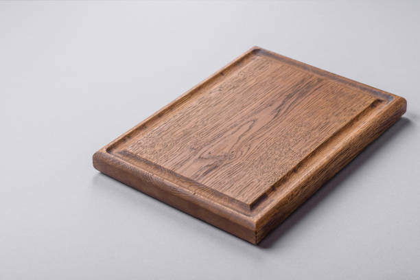 istock Empty wooden cutting board on gray textured concrete background 2149007261