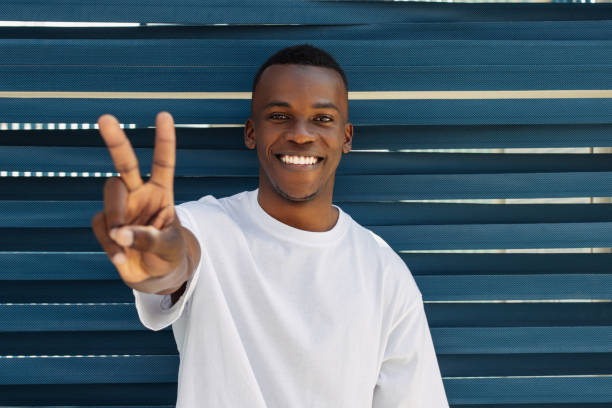 istock Afro american man smiling with happy face doing victory sign 2149007488