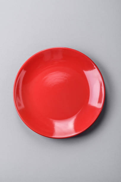 istock An empty plate on a gray concrete background with copy space 2149007498