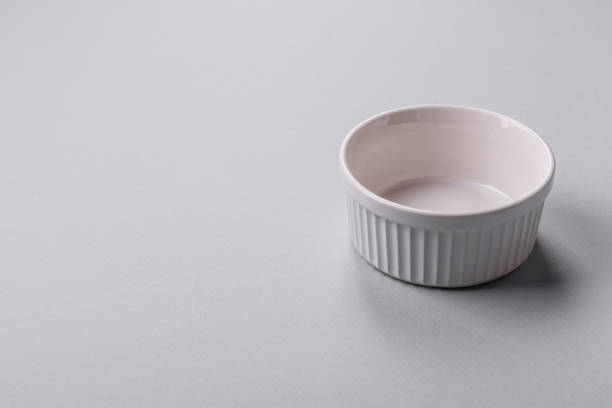 istock An empty plate on a gray concrete background with copy space 2149007570