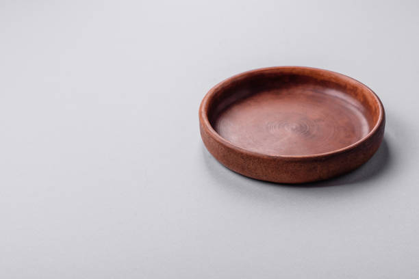 istock An empty plate on a gray concrete background with copy space 2149007615