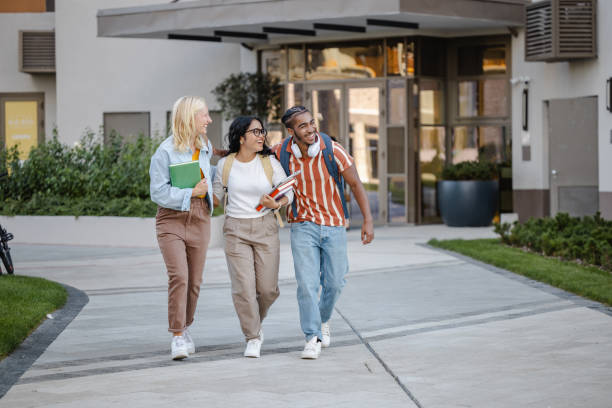istock Happy students on the street after classes 2149007634