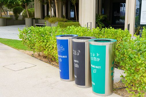 trash cans for collecting separate waste in a city park. High quality photo