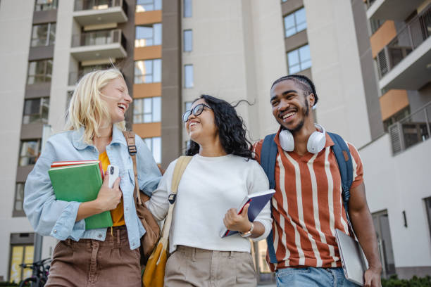 istock Happy diverse small group of students on the street 2149008036