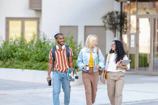 istock Diverse students walking together and chatting 2149008289