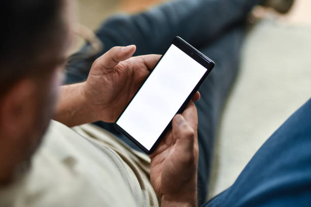 istock Male Checking Email On Smartphone At Home 2149013761