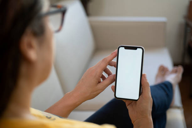 istock Sitting at home holding smartphone. 2149014018