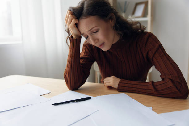 istock Upset unhappy suffering sad frustrated curly adorable woman doing facepalm touch forehead have serious financial problems bad relationships troubles at work worried about debt notification. Copy space 2149014308
