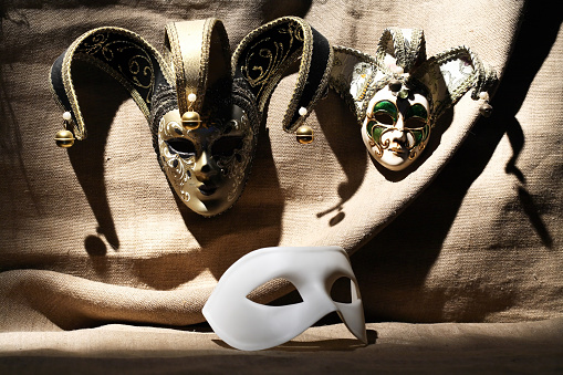 A set of Venetian masks against gray canvas background
