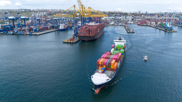 istock Aerial view of cargo container ship leaving port. 2149015402