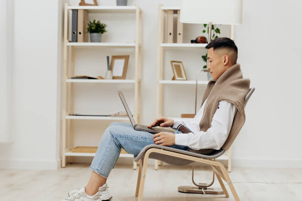 istock man home with laptop in chair interior internet isolated background 2149016889