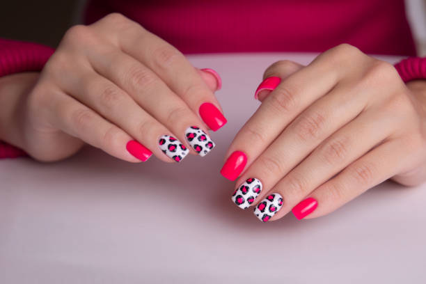 istock Female hands with pink manicure nails 2149017009